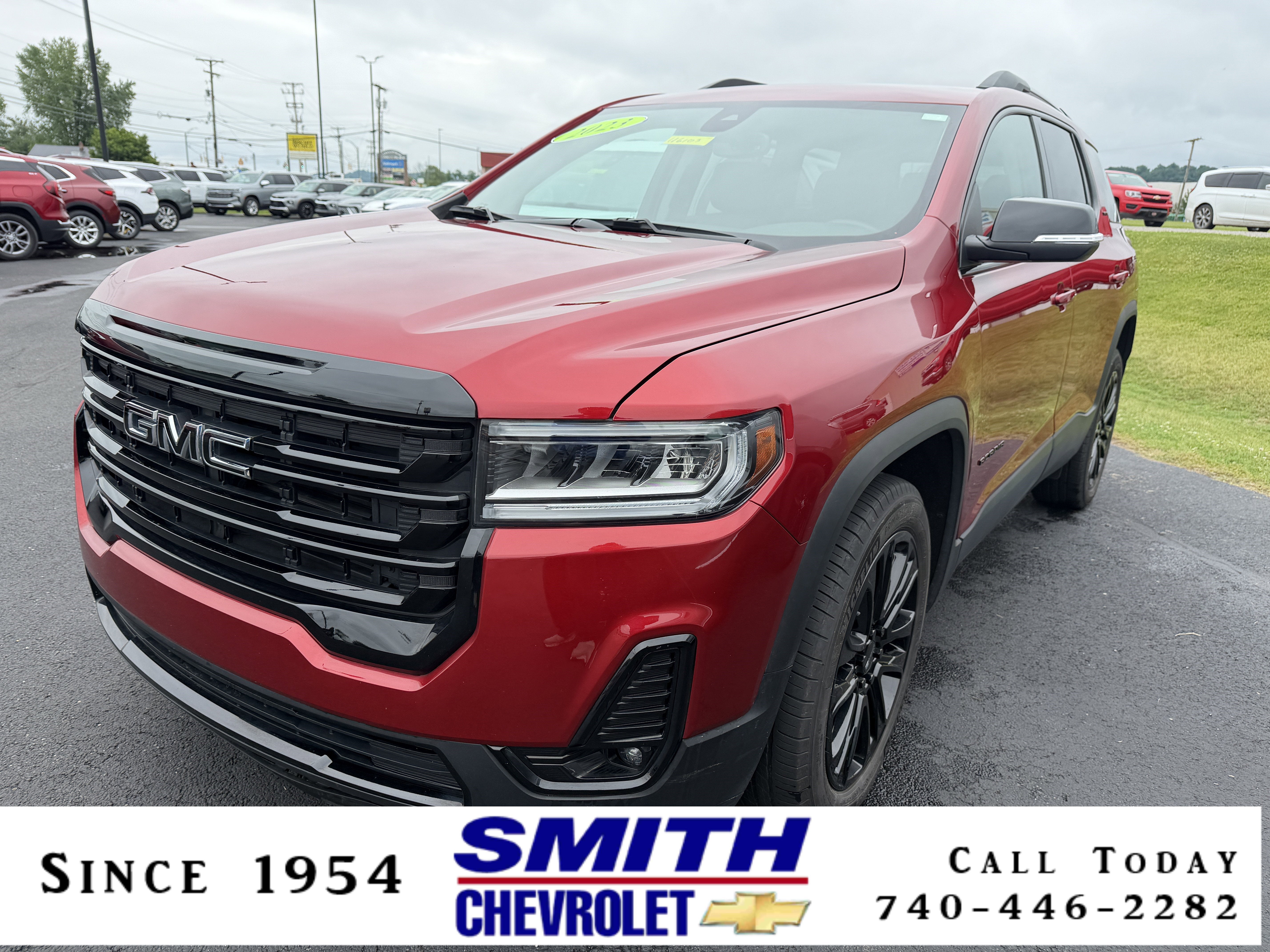 2023 GMC Acadia SLT in Volcanic Red Tintcoat — front three-quarter view