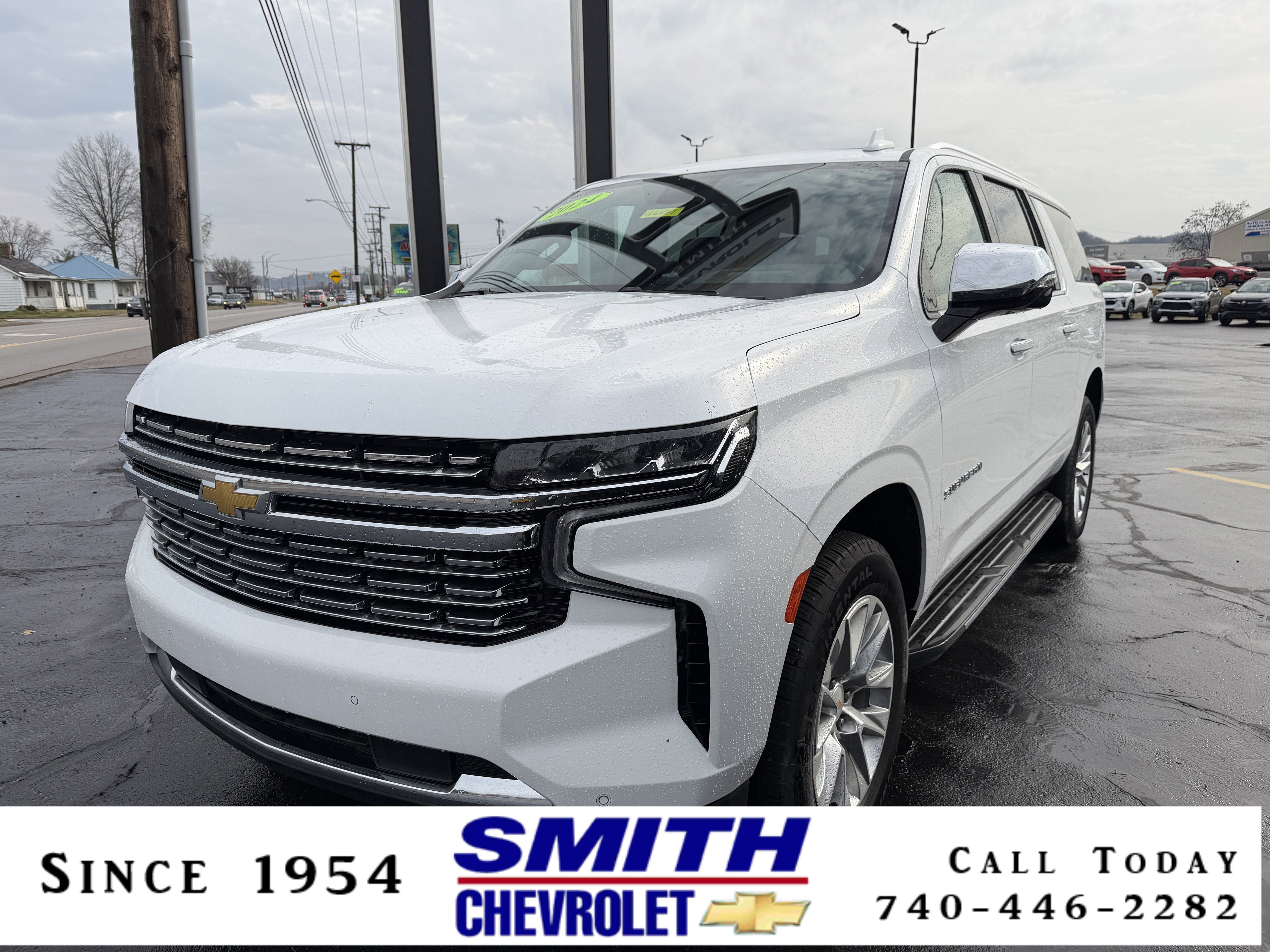 2024 Chevrolet Suburban Premier in Summit White — front three-quarter view