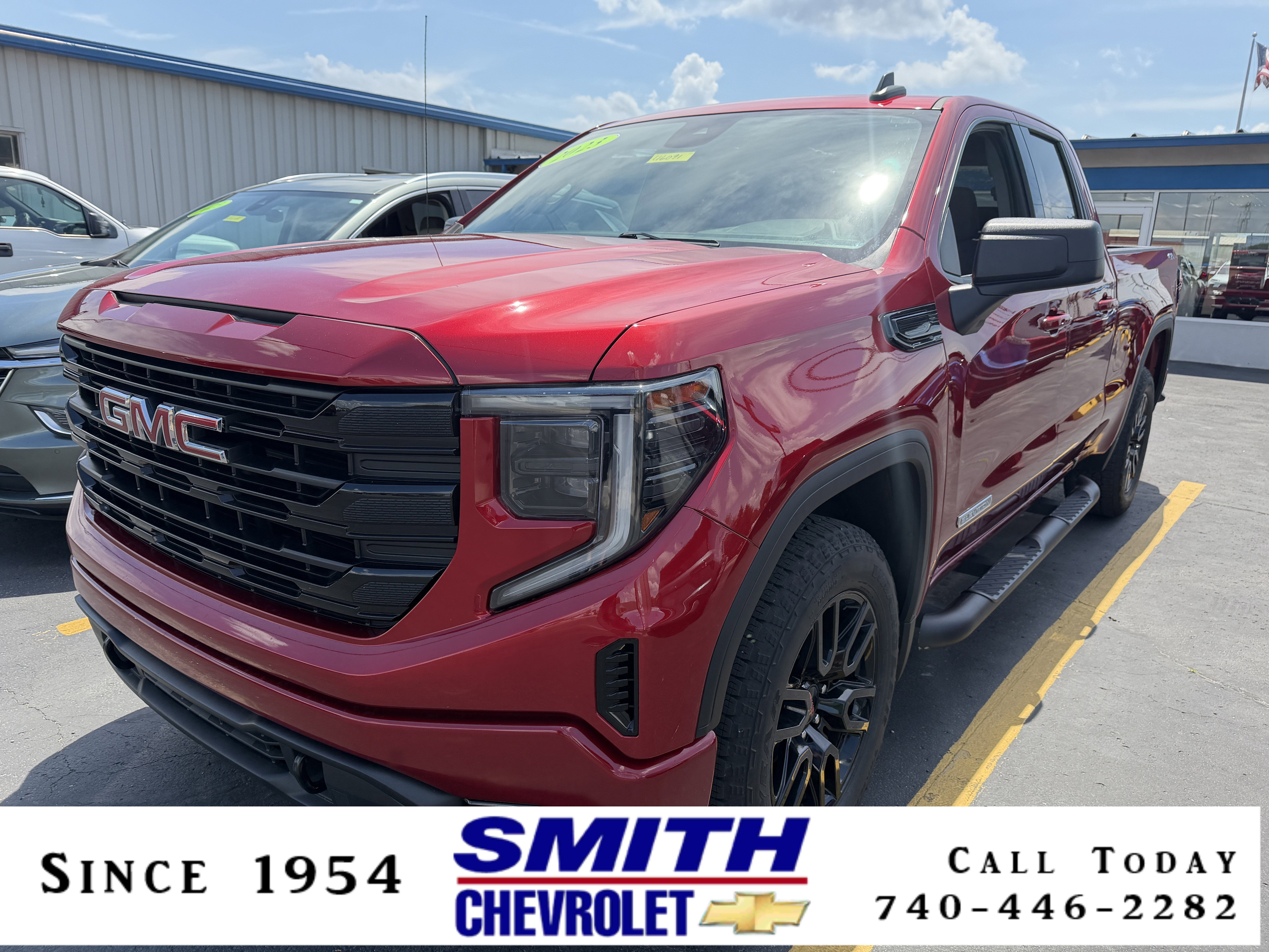 2023 GMC Sierra 1500 Elevation in Volcanic Red Tintcoat — front three-quarter view