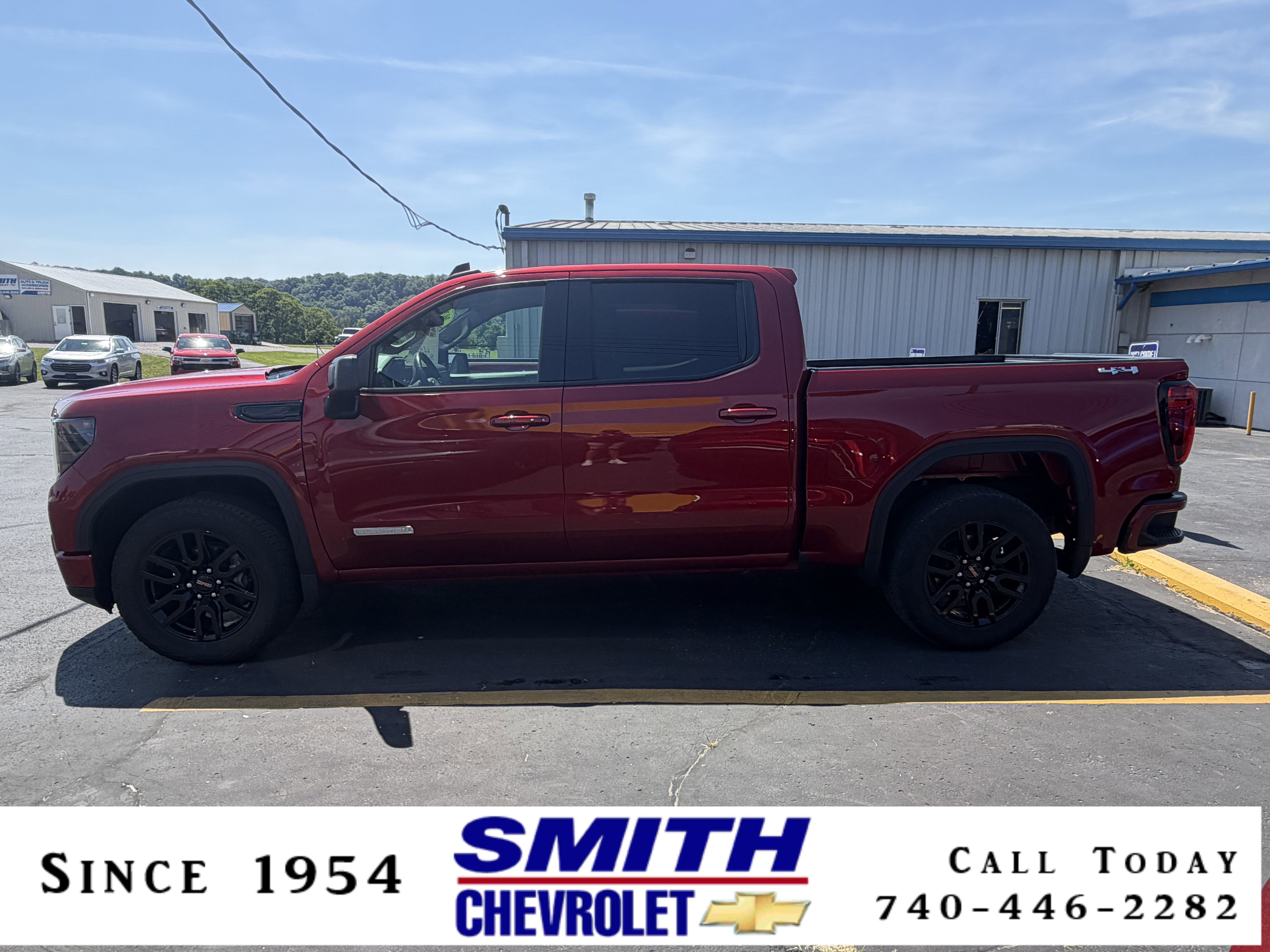 2024 GMC Sierra 1500 Elevation in Volcanic Red Tintcoat — front three-quarter view