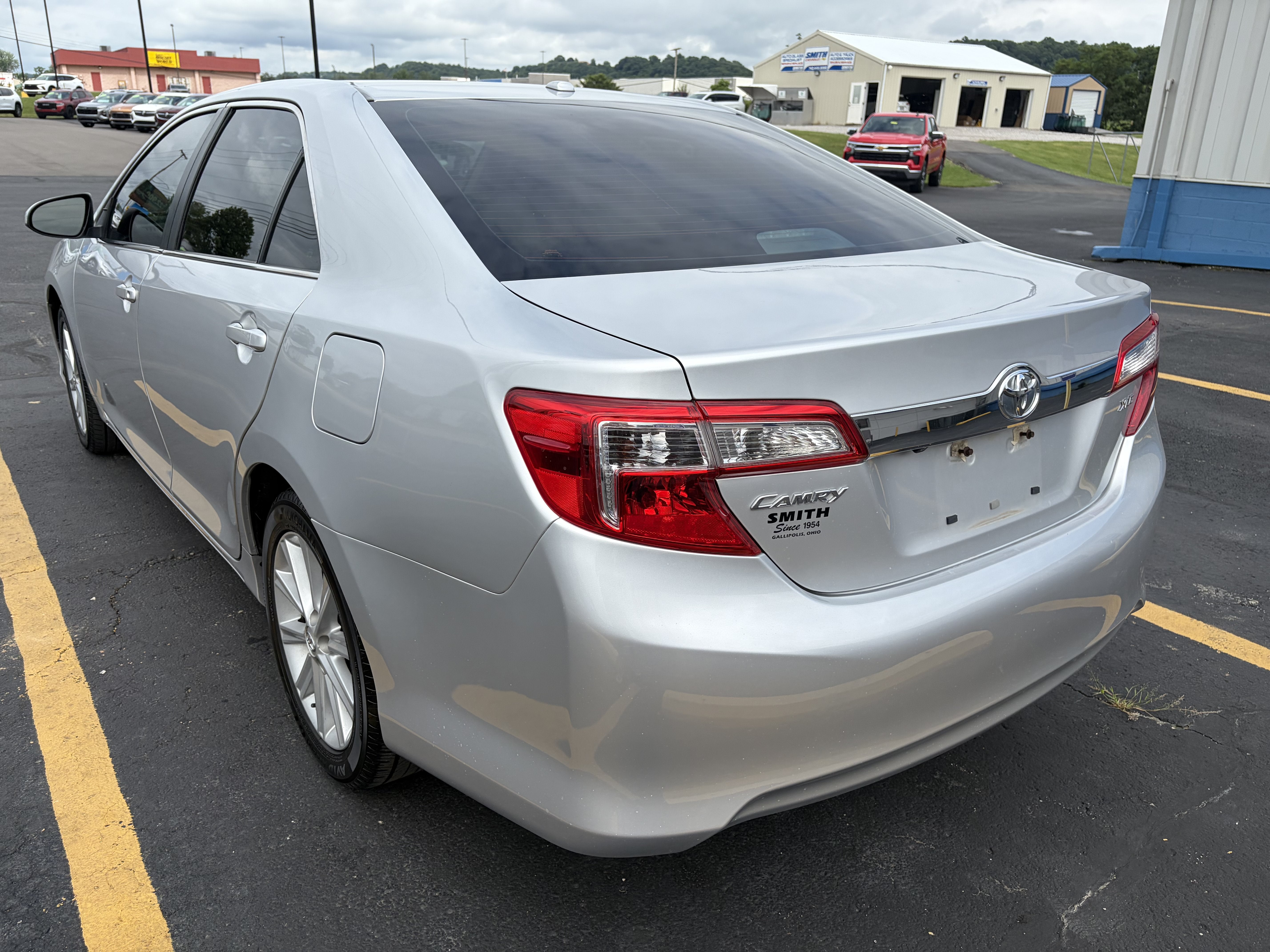 2013 Toyota Camry — rear three-quarter view